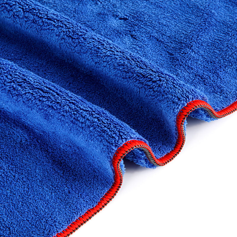 Are there specific features or qualities that make a beach towel suitable for outdoor use?